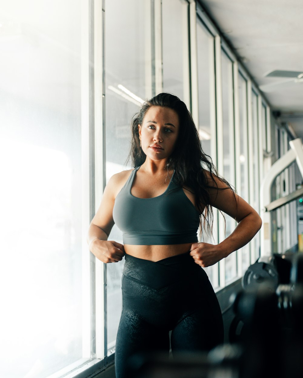 a woman in a sports bra top and leggings