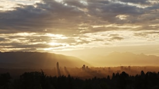 An inspiring view of a sunrise over a city skyline.