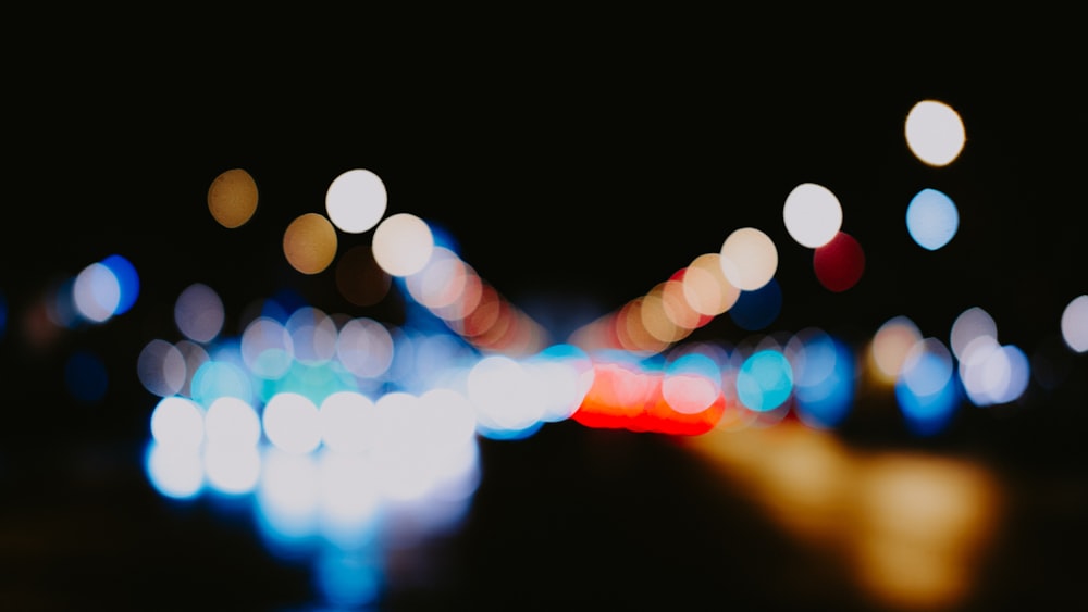 a blurry photo of a city street at night