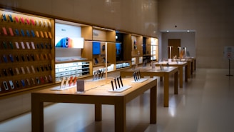 a row of wooden tables in a store