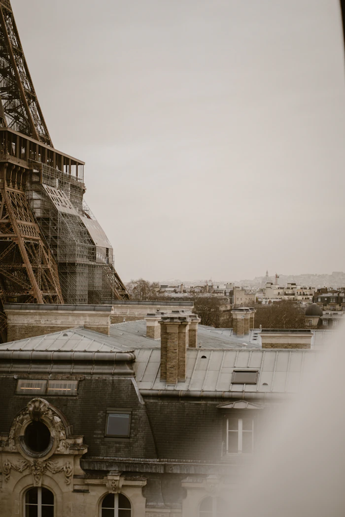 Rooftop terrace overlooking Paris with the Eiffel Tower at dusk