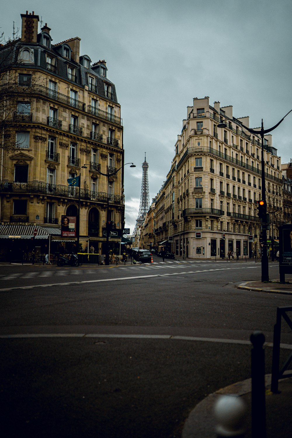 a city street with tall buildings and a traffic light