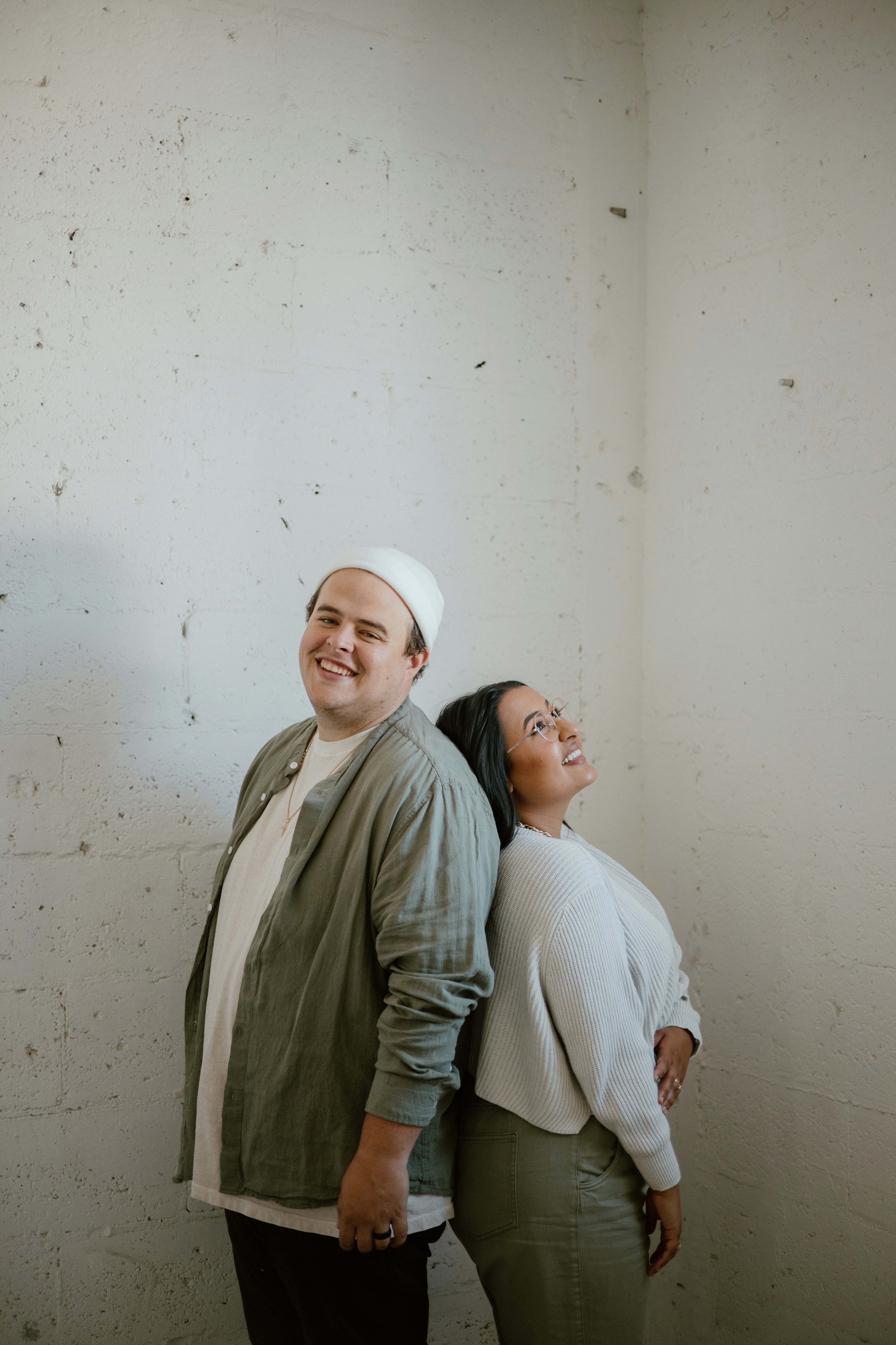 A man and a woman standing next to each other photo – Free Grey Image ...