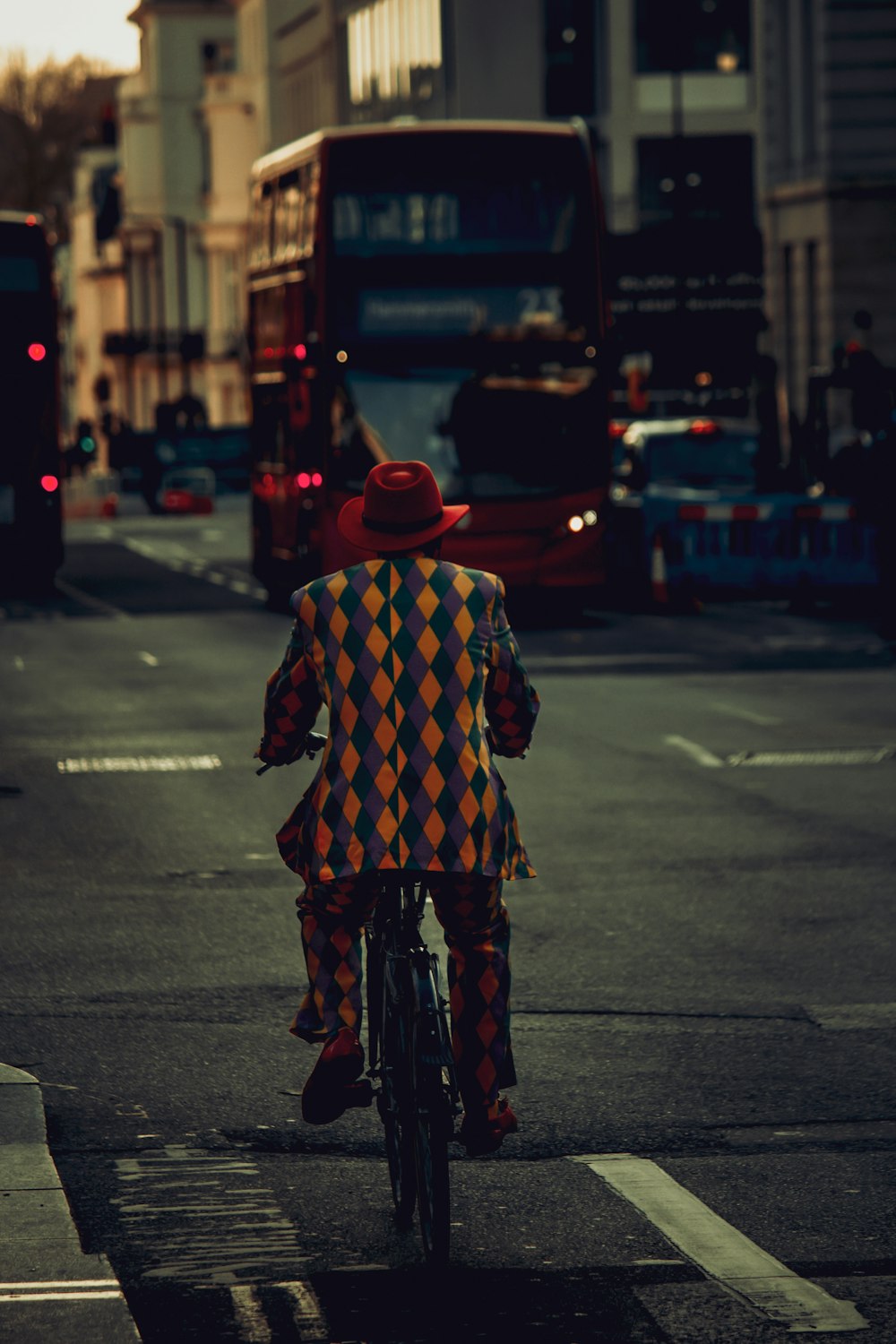 a man riding a bike down a street