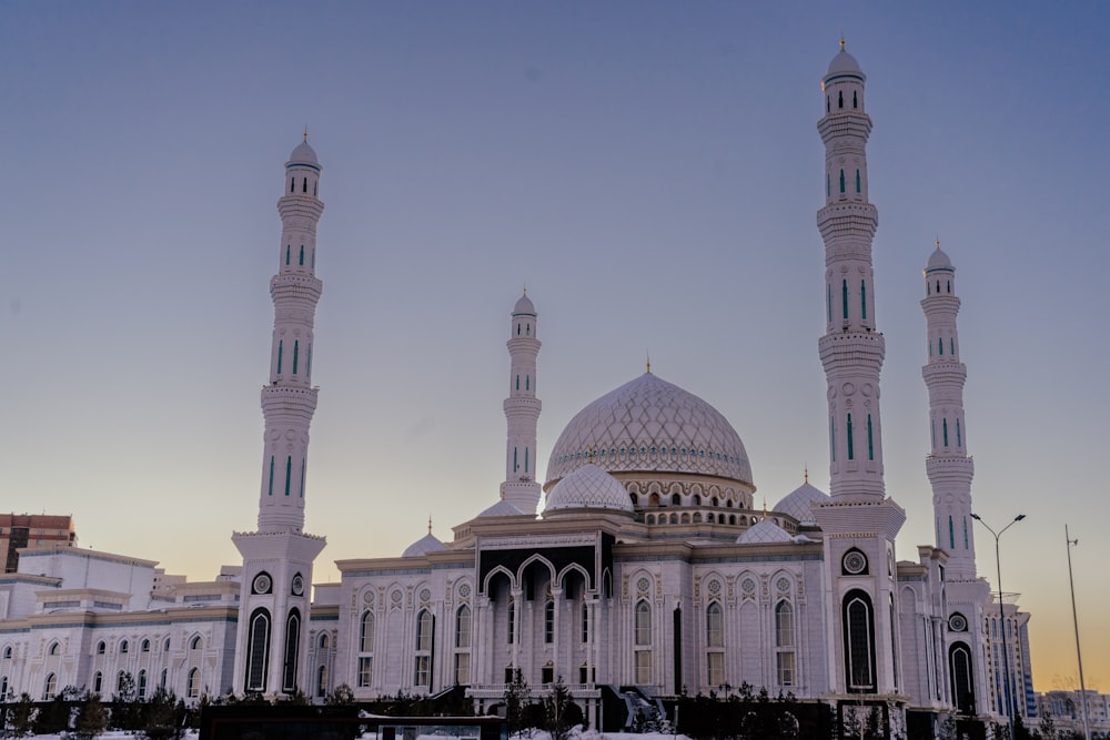 a large white building with two towers and a dome