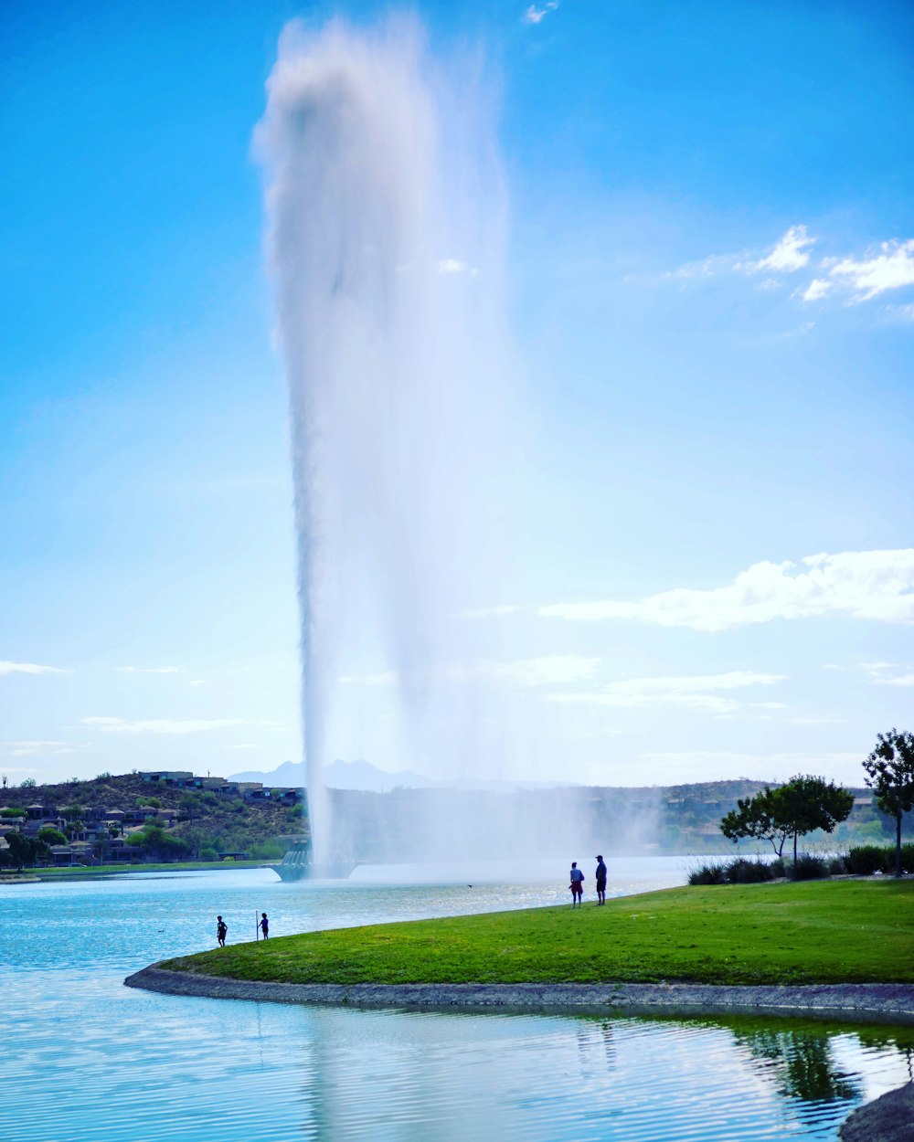 a large geyser spewing water into the sky