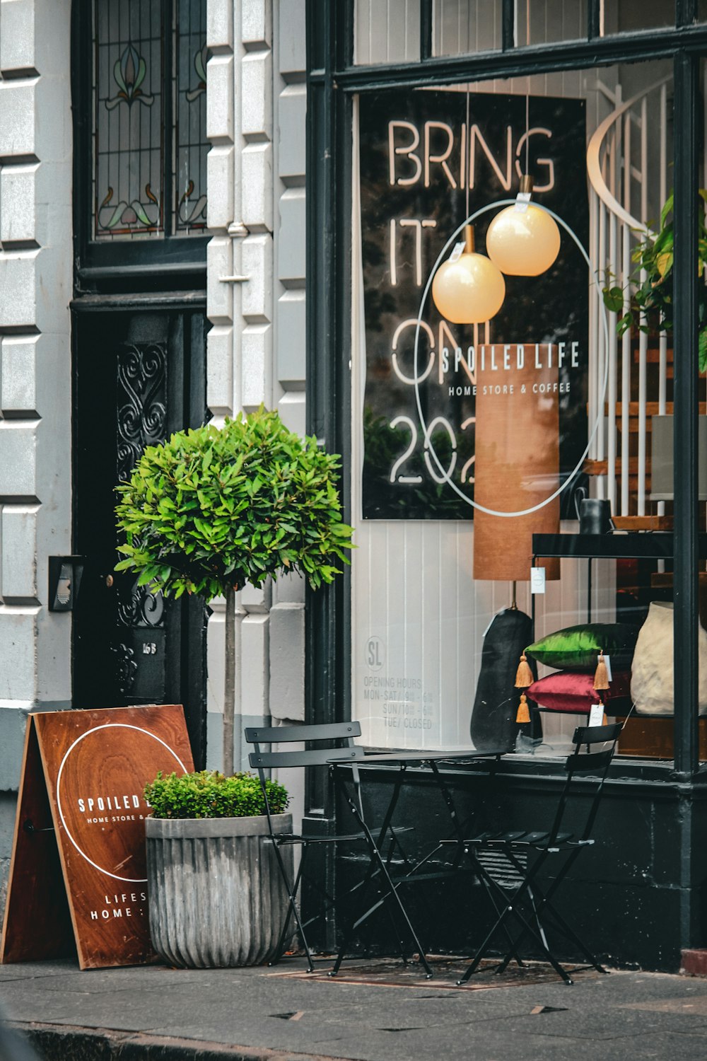 a table and chairs outside of a building