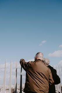 a man and a woman are looking at the sky