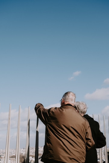 a man and a woman are looking at the sky