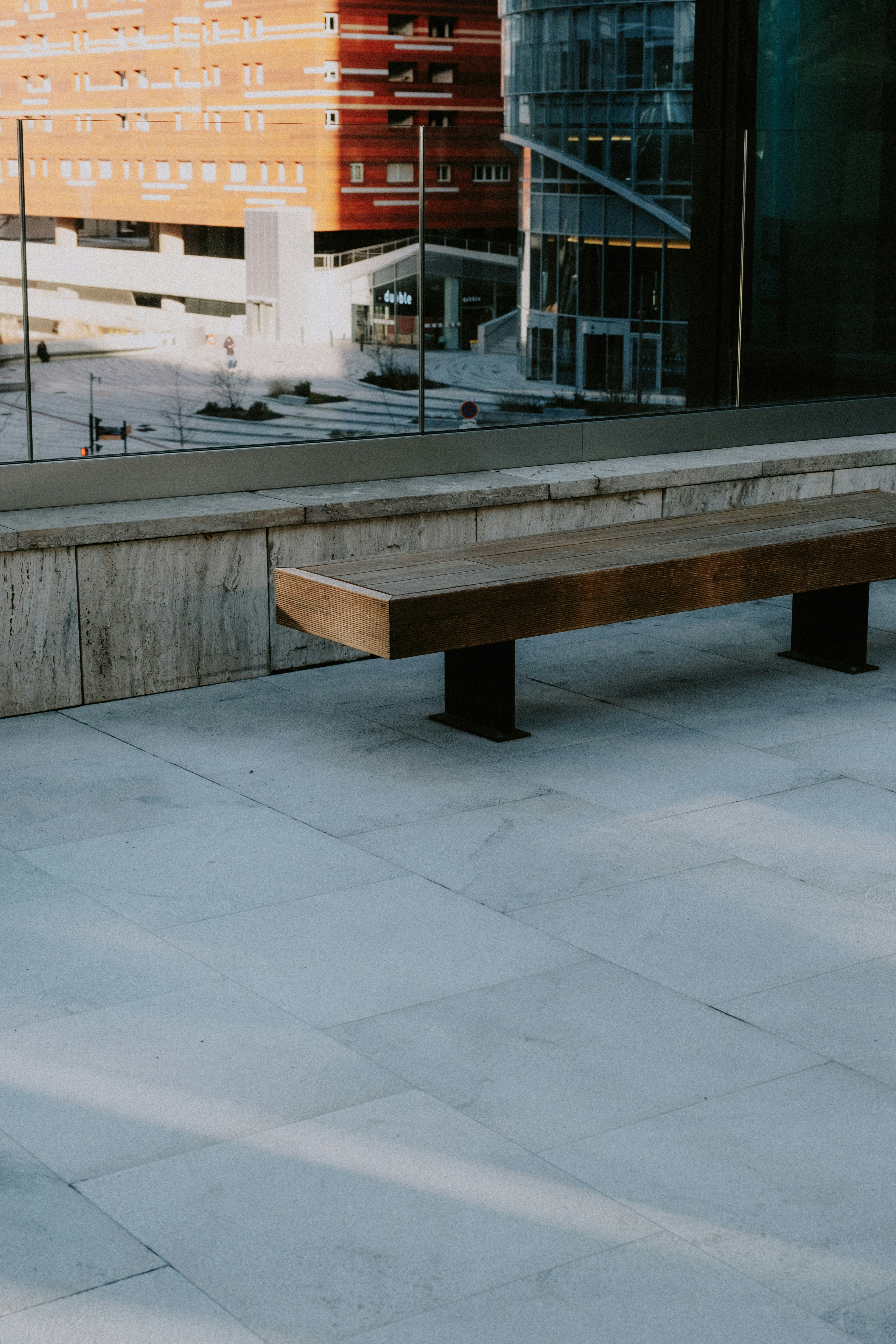 A wooden bench sitting in front of a building photo – Free Paris Image ...