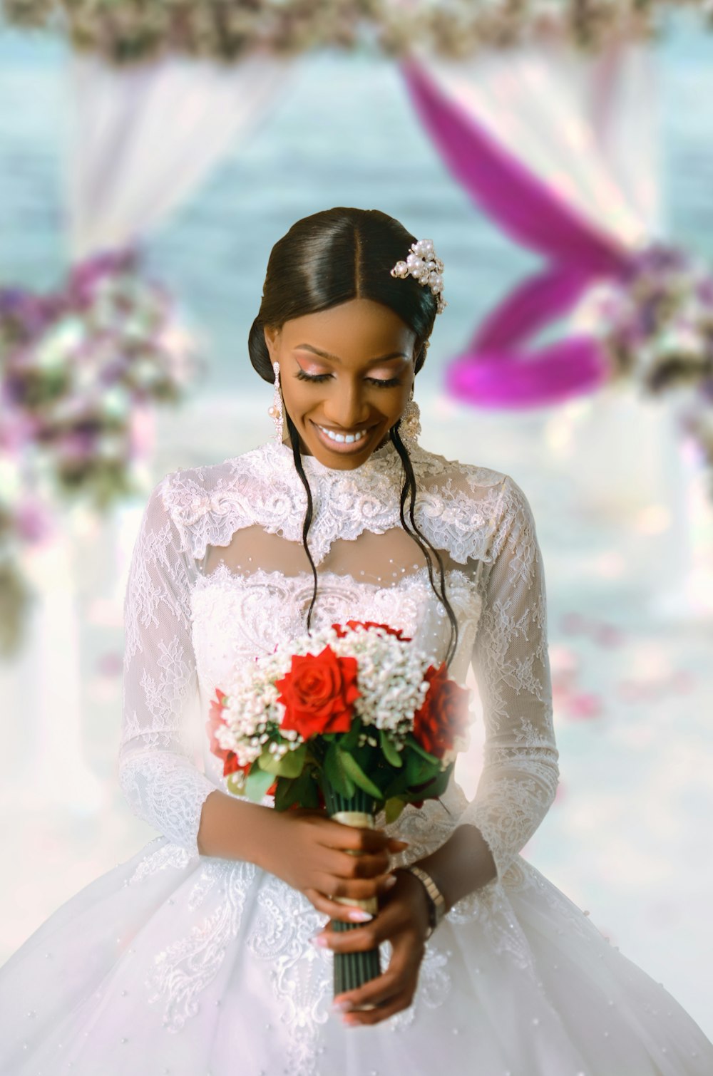 a woman in a wedding dress holding a bouquet of flowers