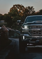 the front end of a pickup truck on a road