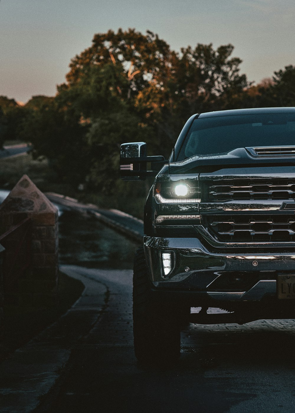 the front end of a pickup truck on a road