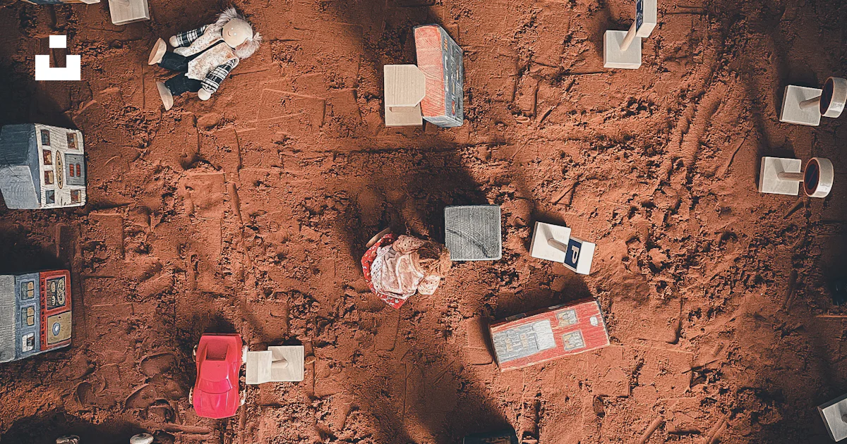 An aerial view of a bunch of objects on the ground photo – Free Grey ...