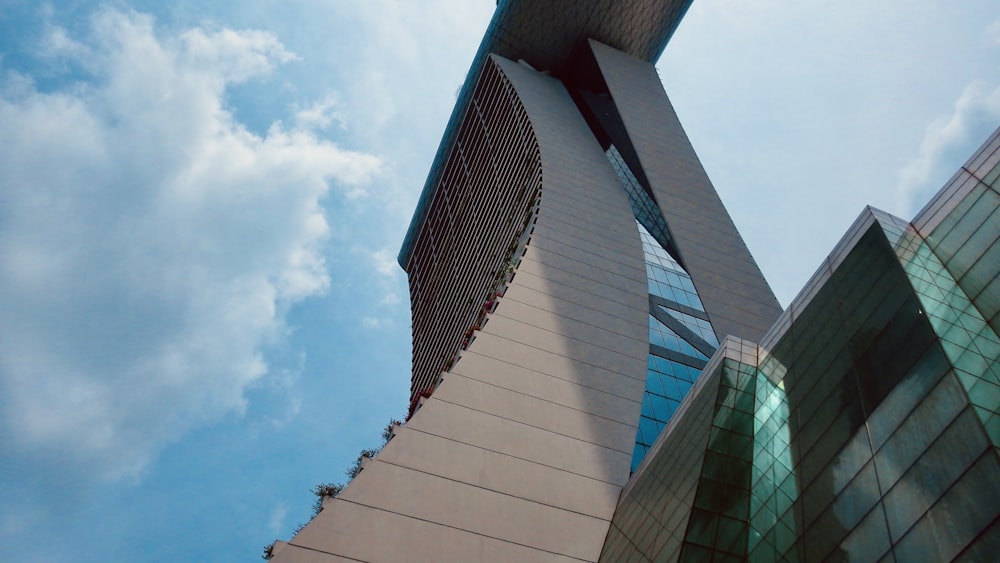 a very tall building with a sky background