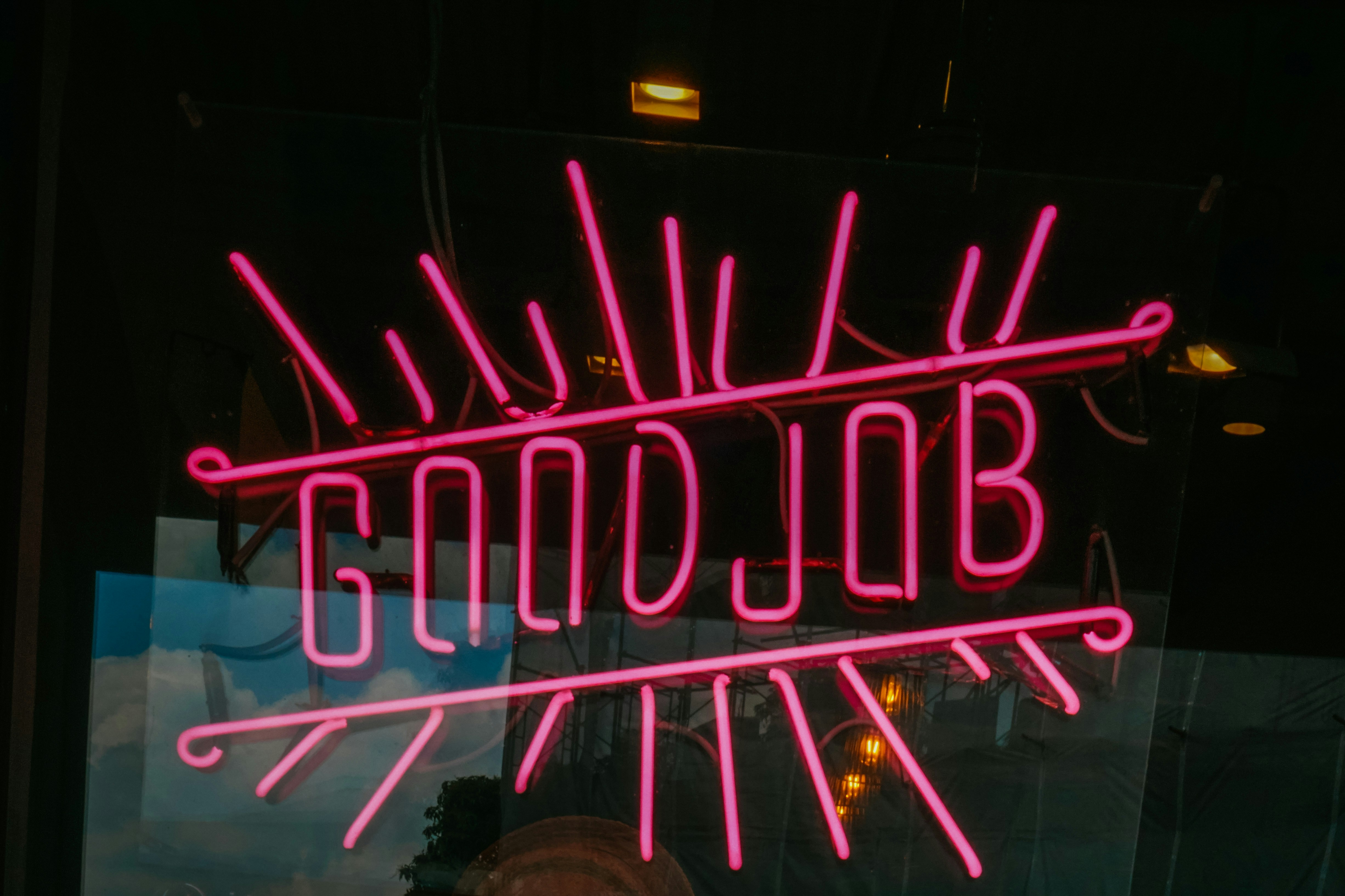 a neon sign that says goodbye on it