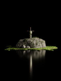Close-up of a silver sword embedded in a stone circle under dappled forest light.