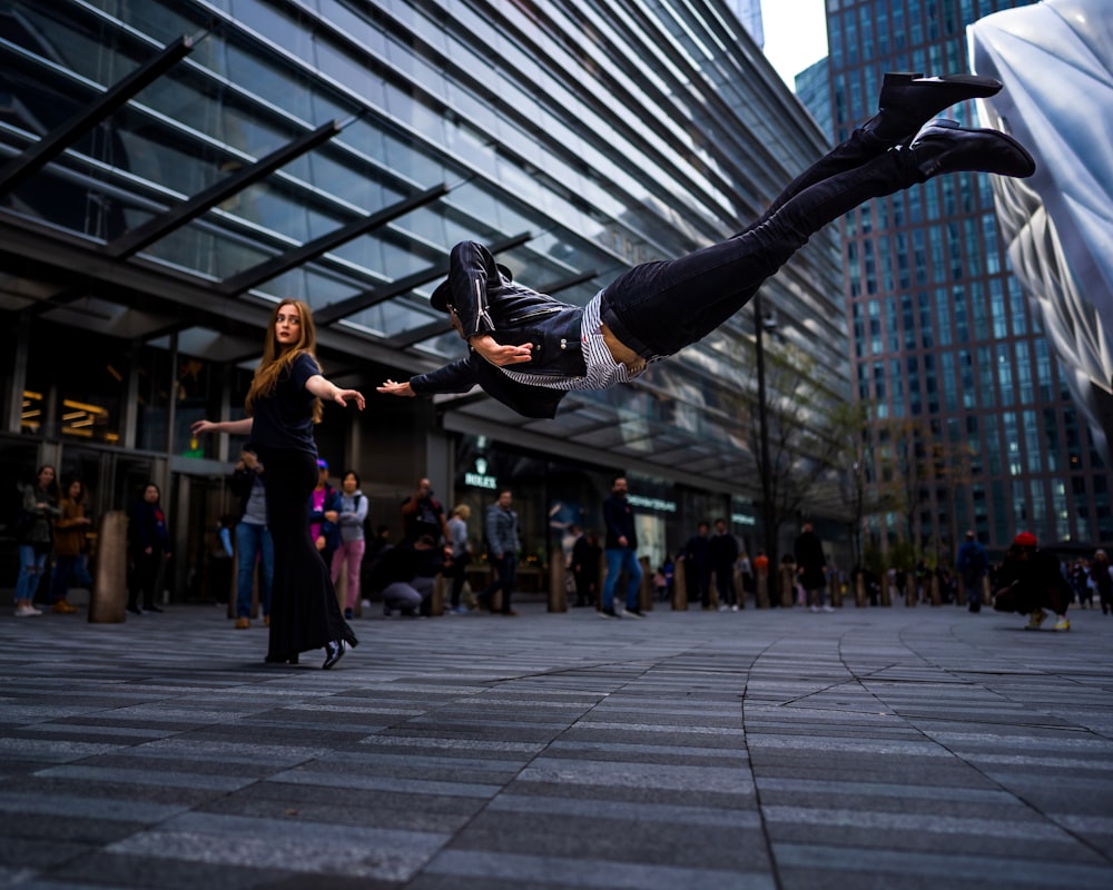 a man flying through the air while riding a skateboard