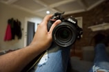 a person holding a camera in their hand
