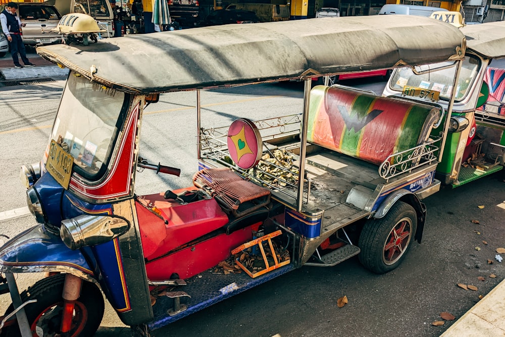 a colorful vehicle is parked on the side of the road