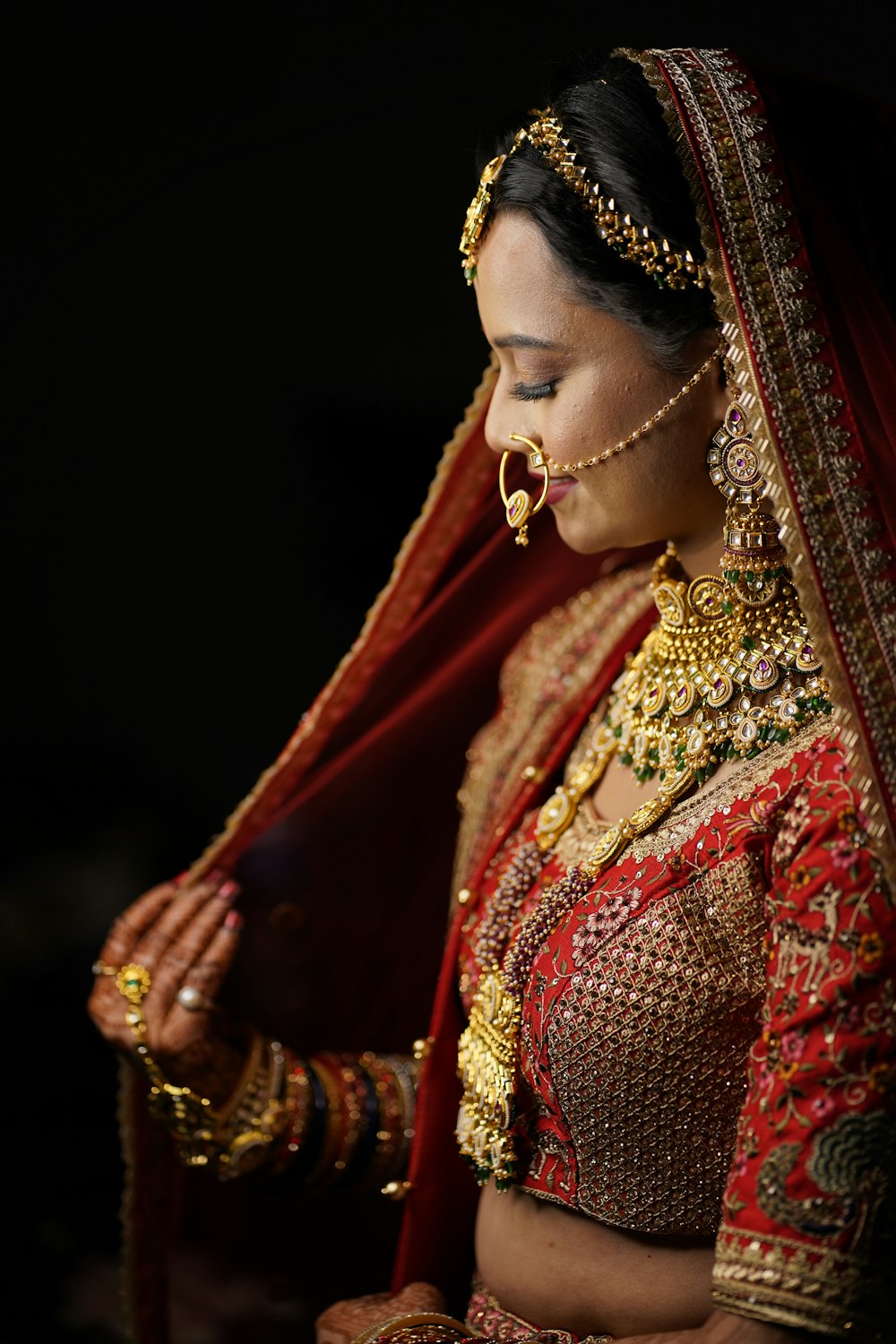 a woman in a red and gold outfit