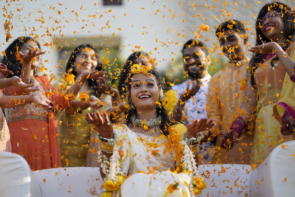 a bride and groom surrounded by confetti