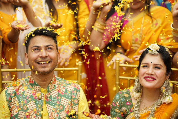 a man and a woman standing in front of a group of people