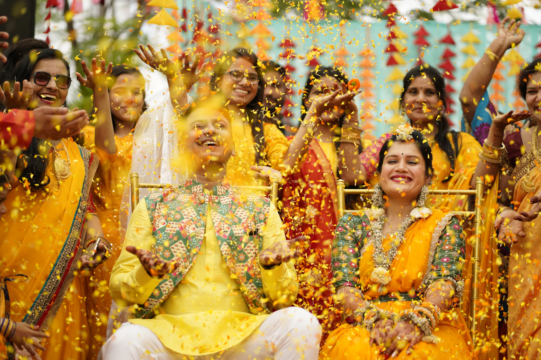Friends in yellow celebrating a haldi ceremony