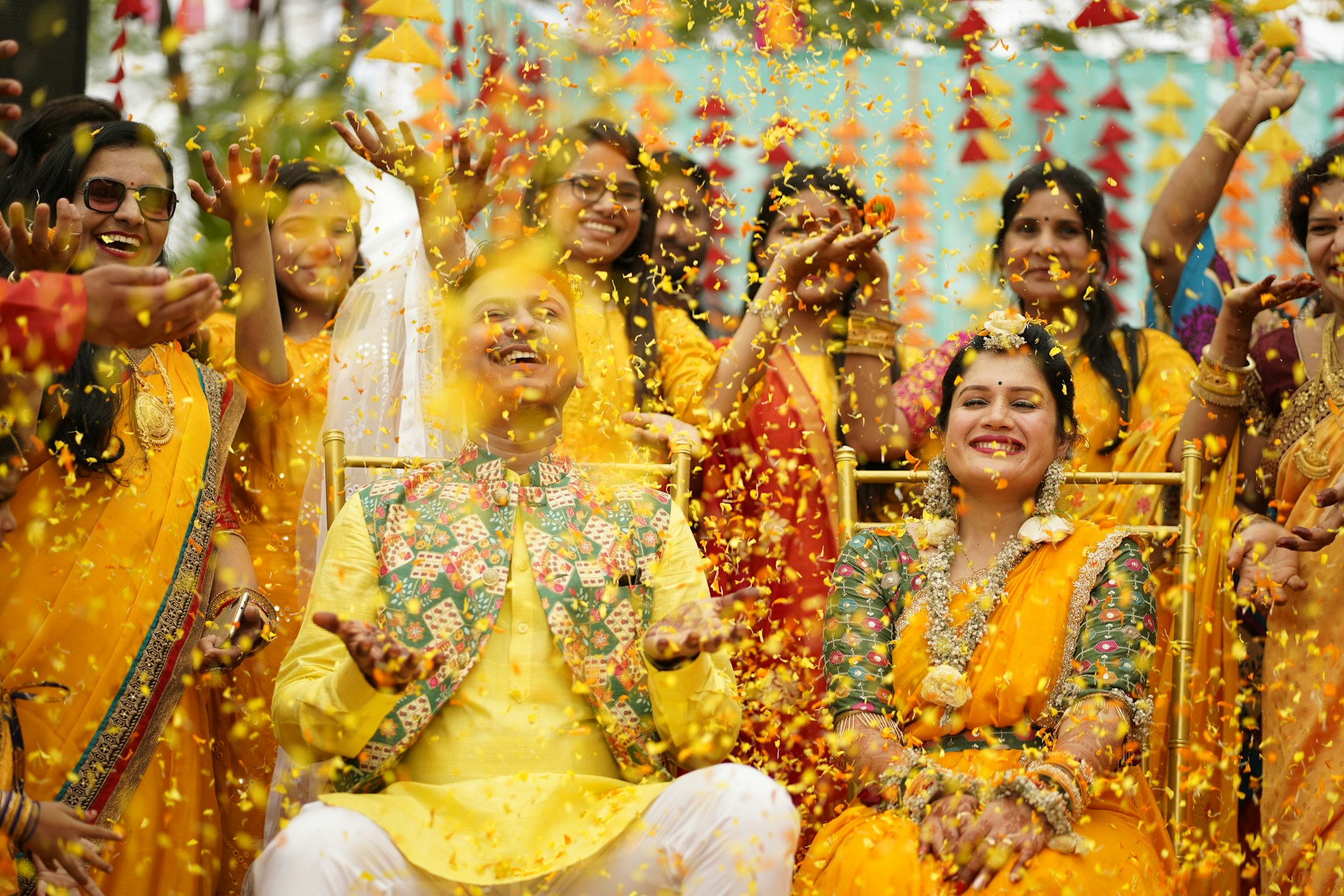 a group of people dressed in yellow and orange