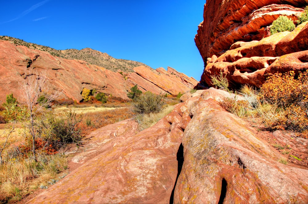 a large rock formation in the middle of a desert