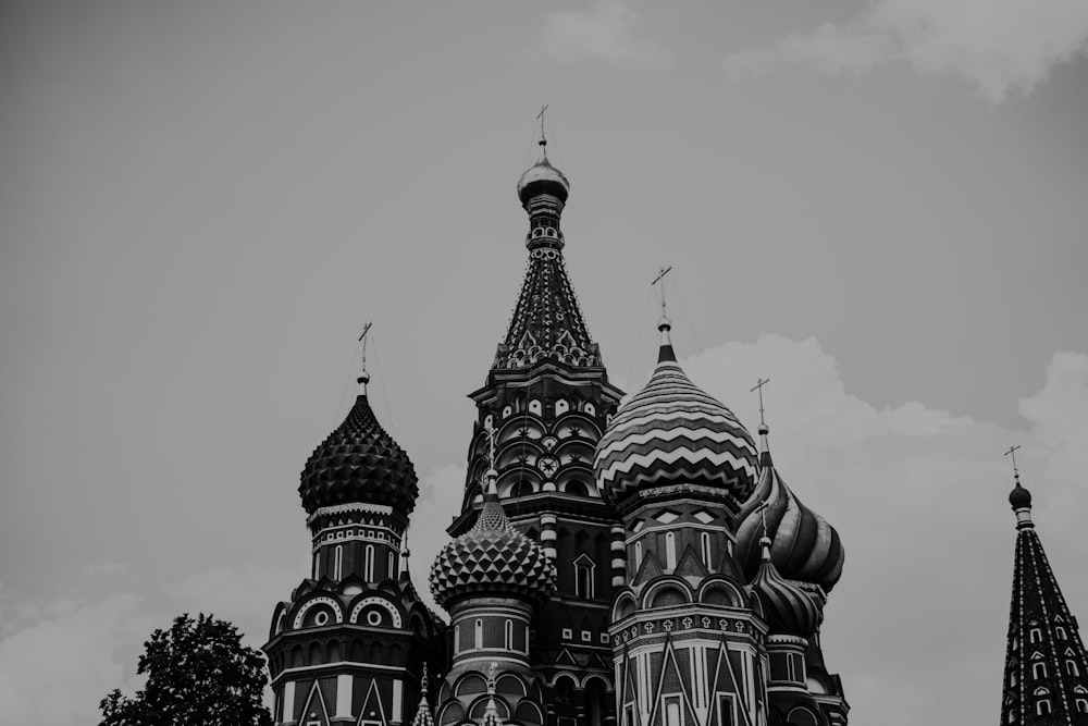 a black and white photo of a building with domes