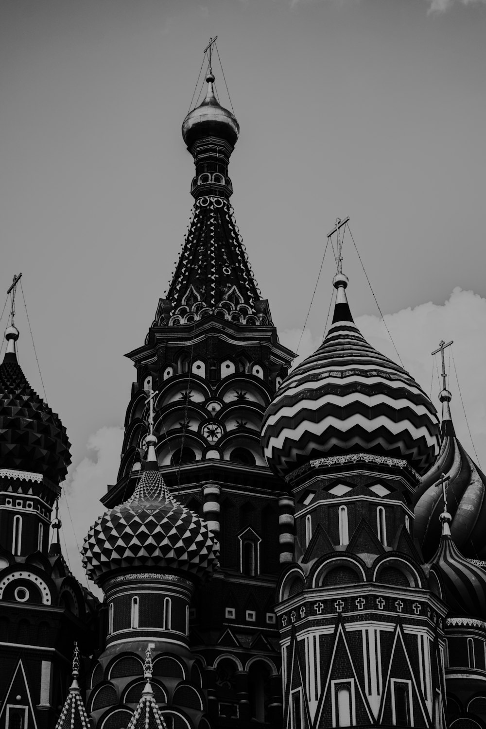 a black and white photo of a building with domes