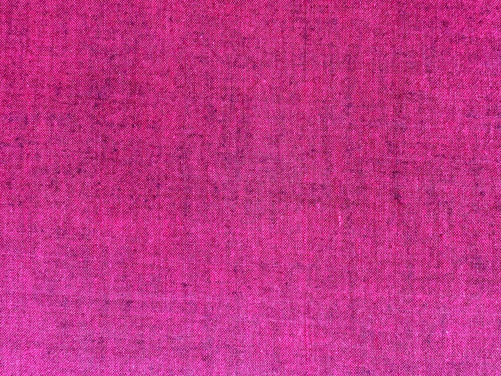 a pink background with a very small amount of color