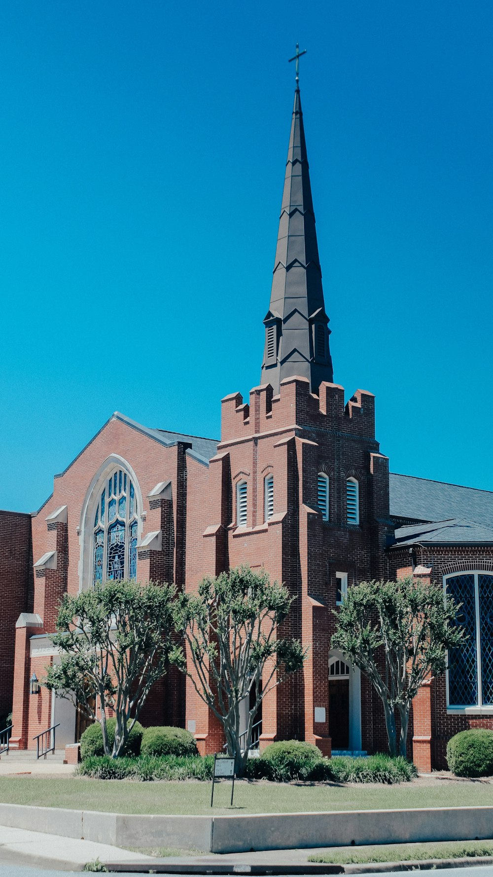 a church with a steeple and a clock tower