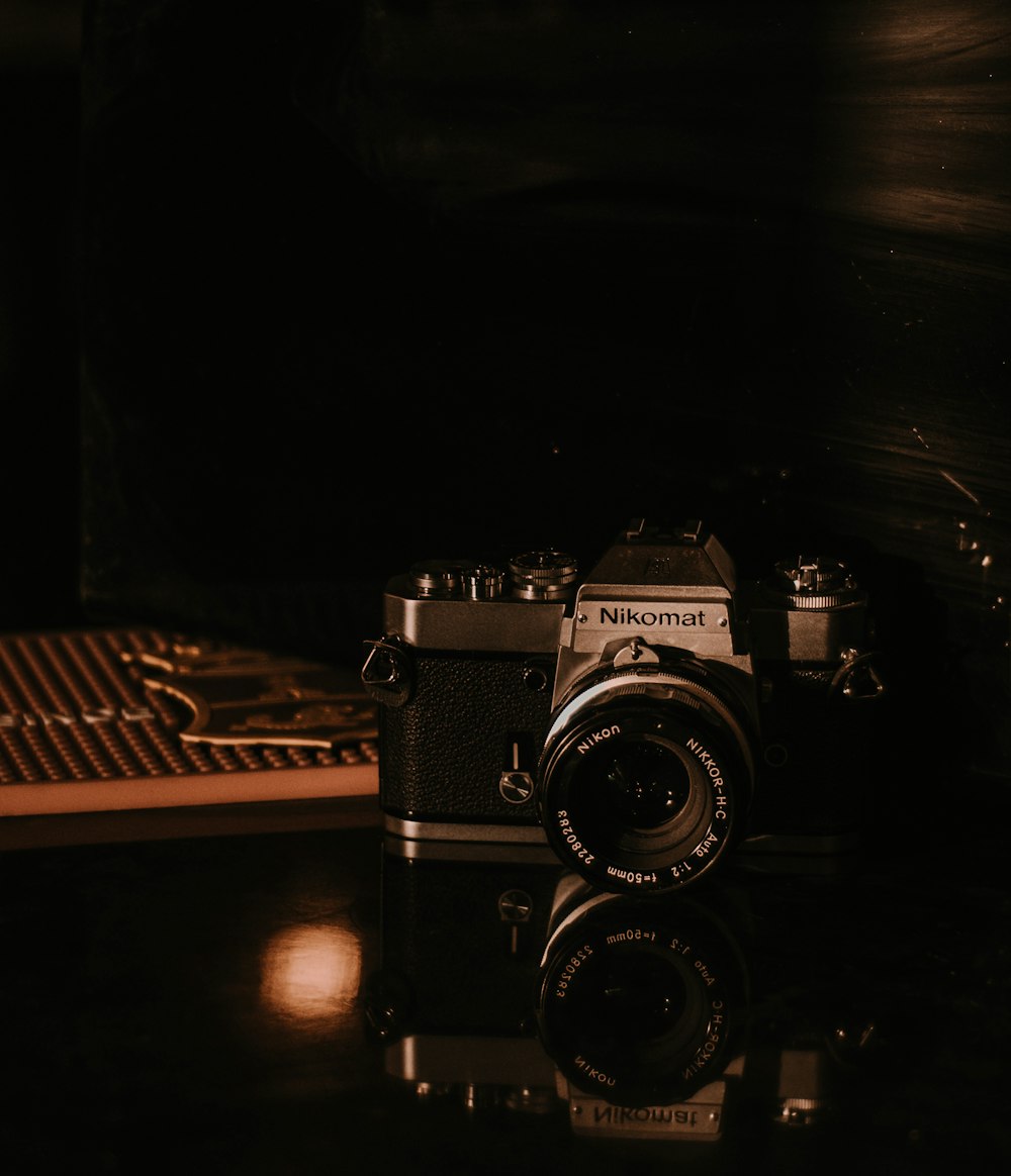 a camera sitting on top of a wooden table