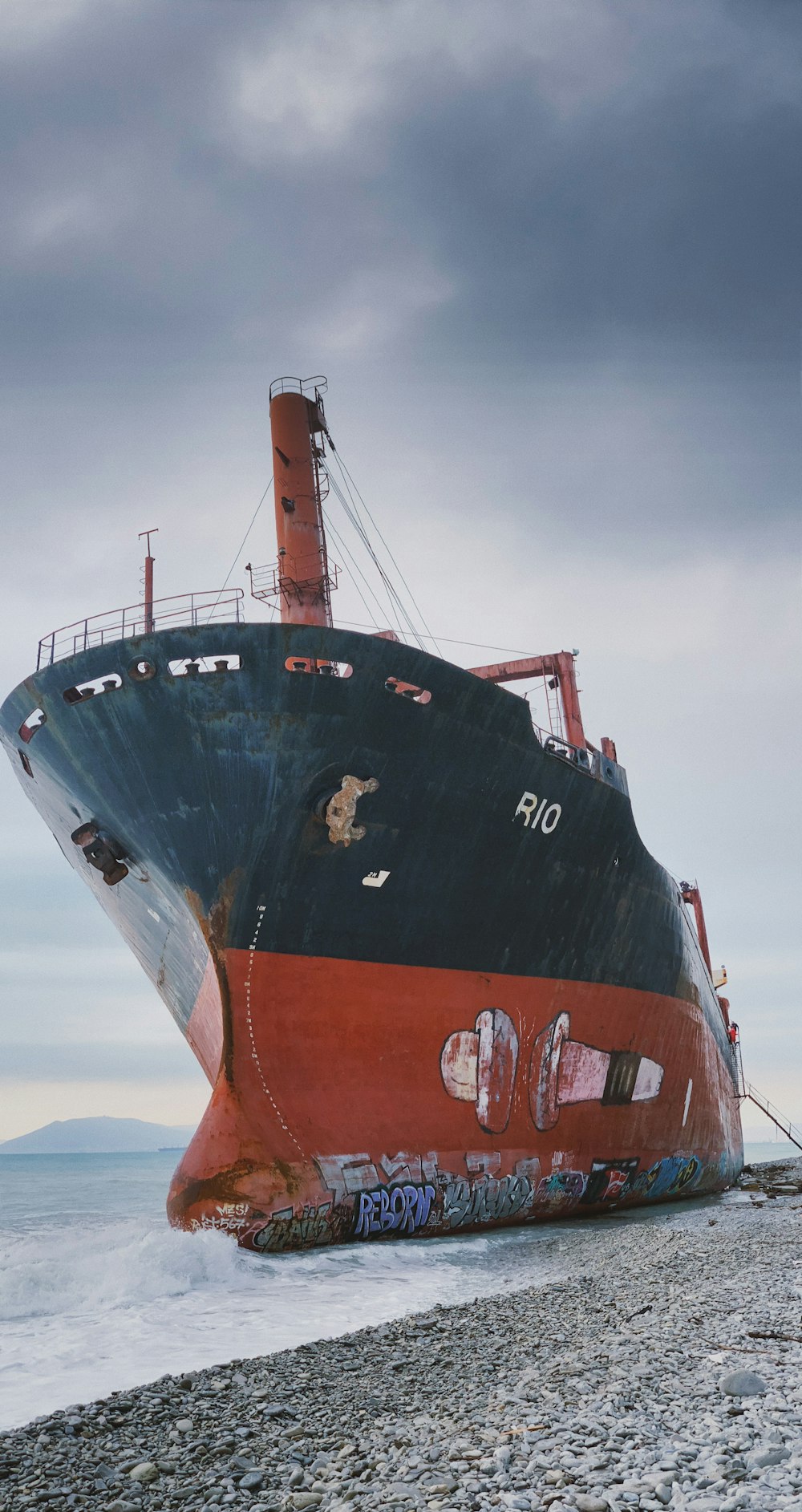 a large ship sitting on top of a sandy beach