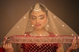 a woman wearing a veil and holding a piece of cloth