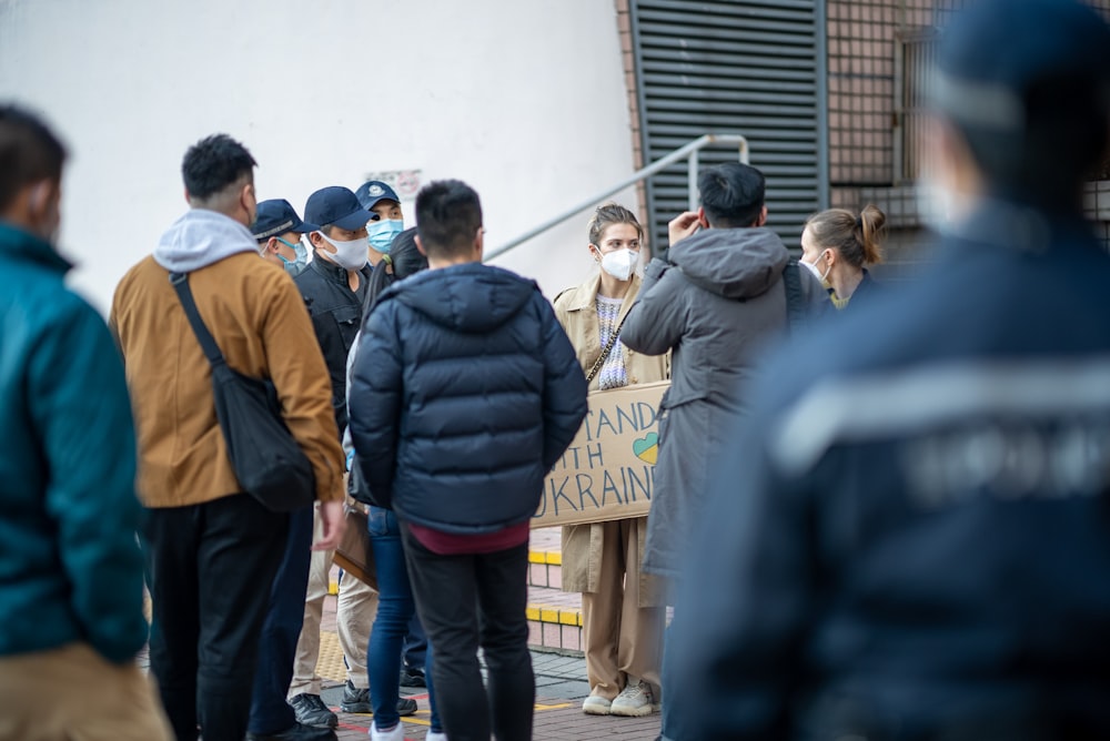 a group of people standing outside of a building