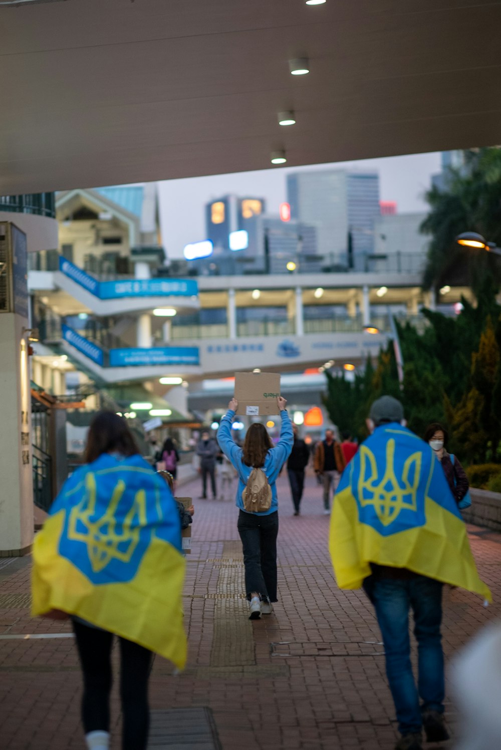 a group of people walking down a street