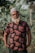 a man with a white beard wearing a floral shirt