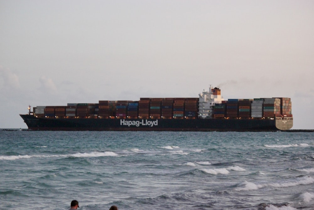 a large cargo ship in the middle of the ocean