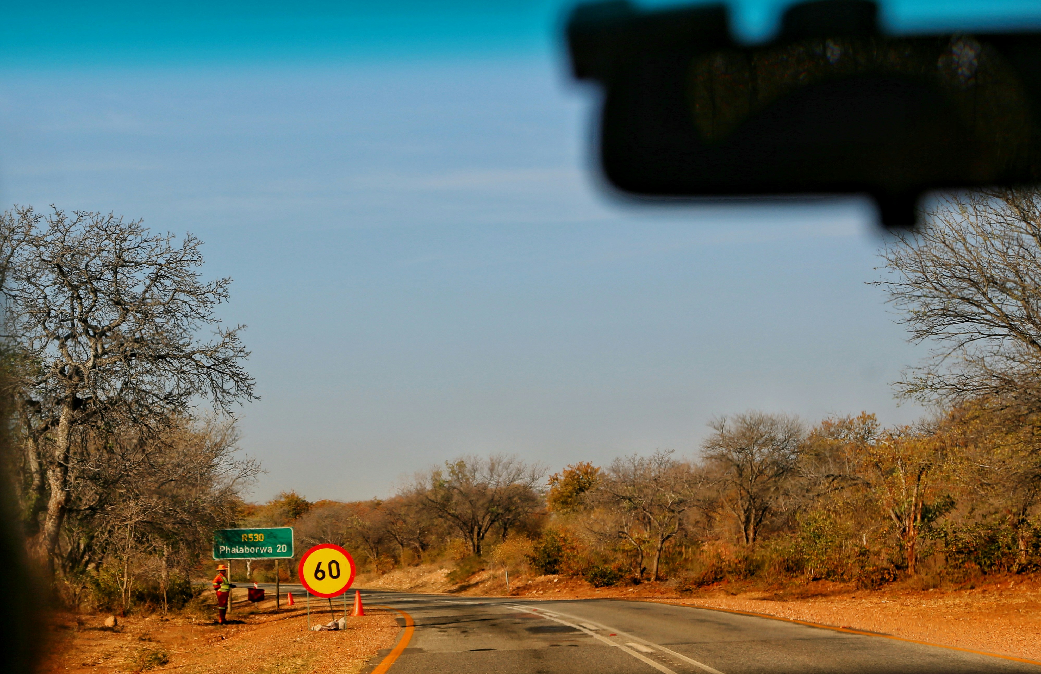 a view of a street sign from a car window