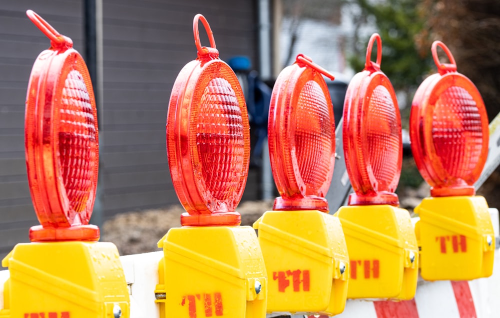 a row of fire hydrants sitting next to each other