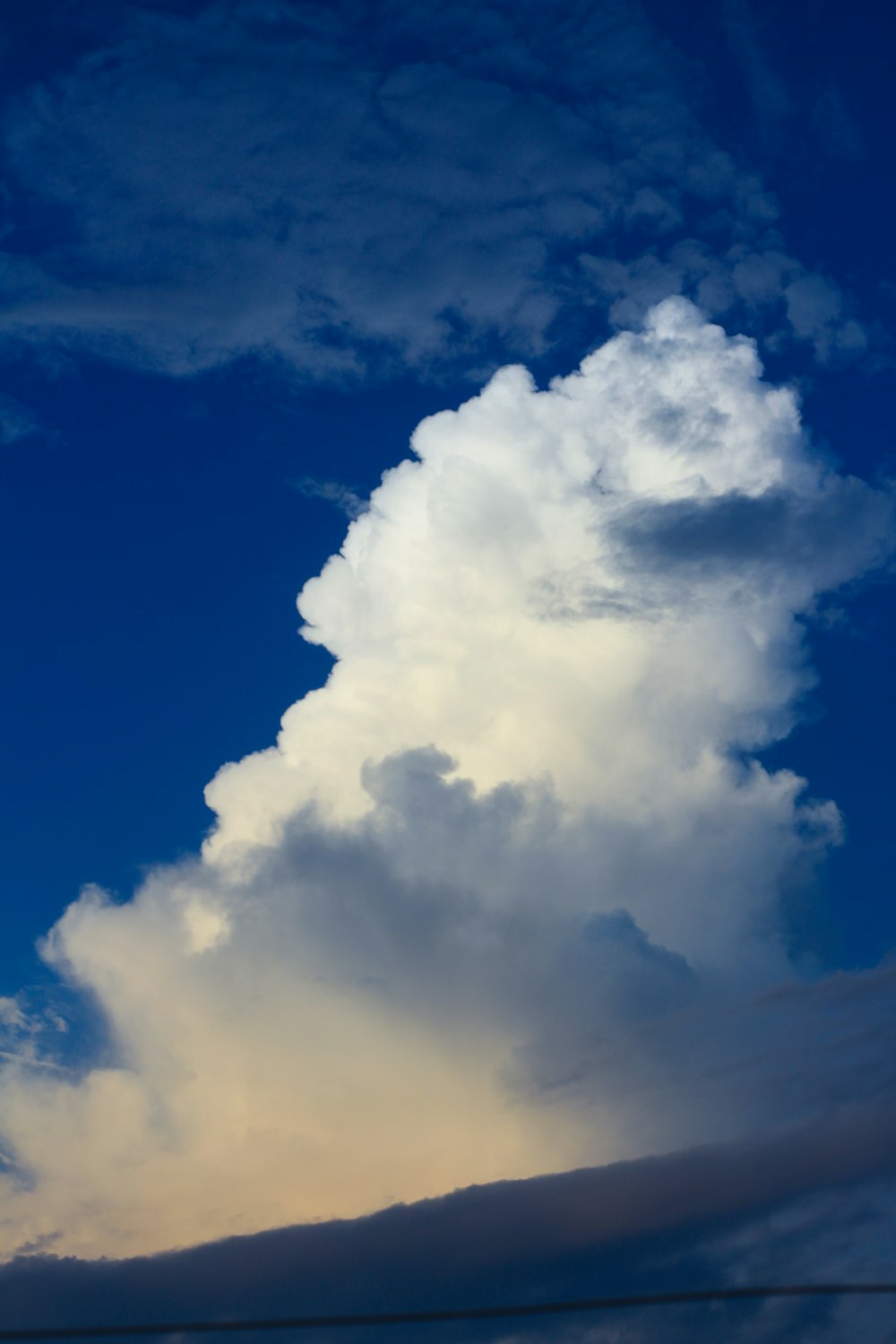 a plane flying in the sky with a lot of clouds