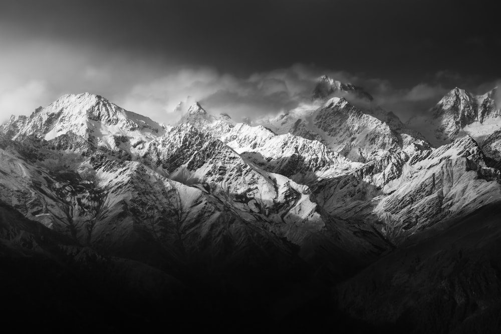 a black and white photo of a mountain range