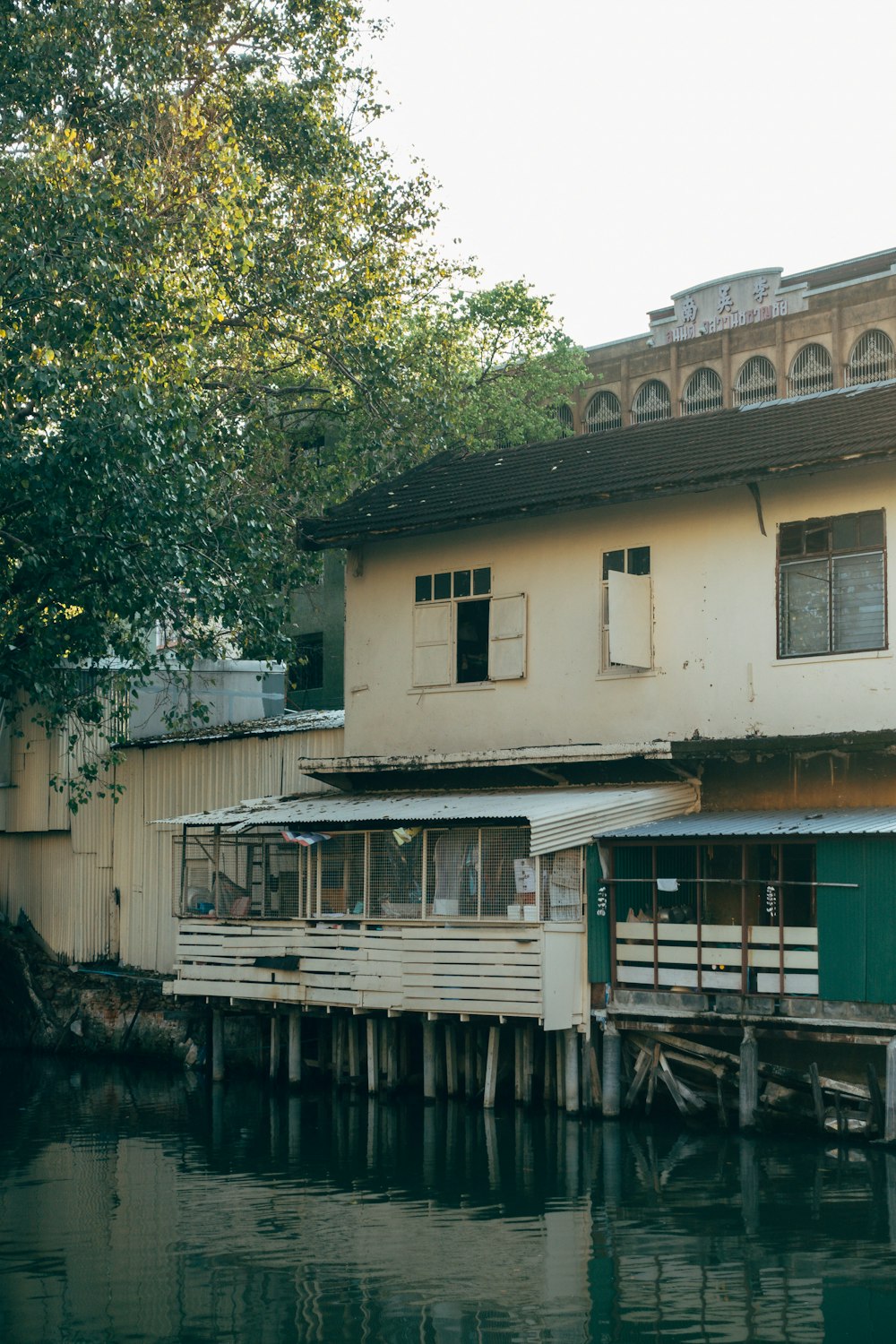 a house sitting on the side of a body of water