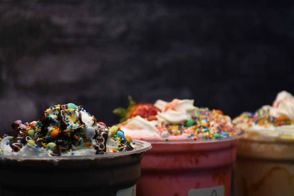 a close up of three cups of ice cream