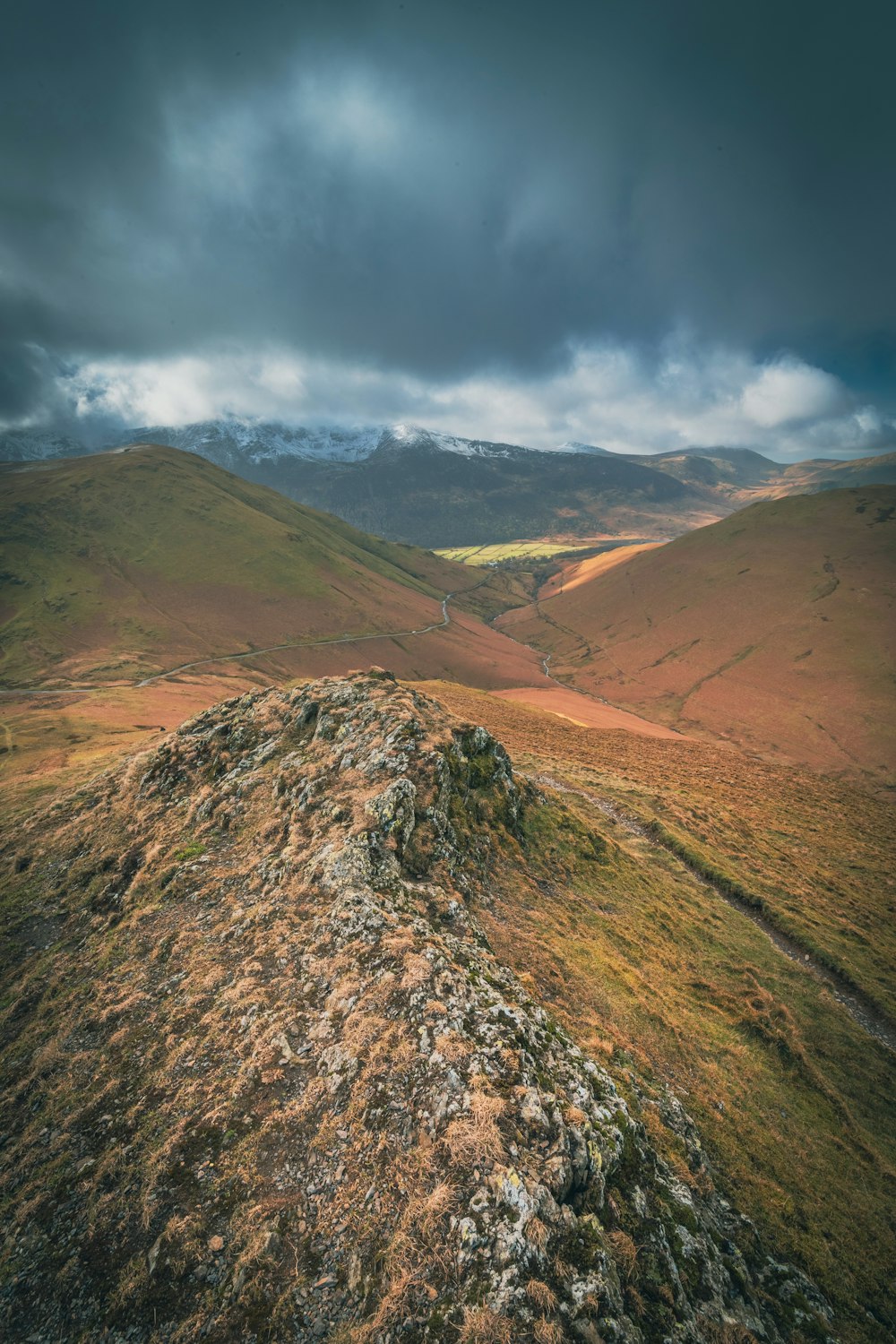 a view of a mountain range with a cloudy sky