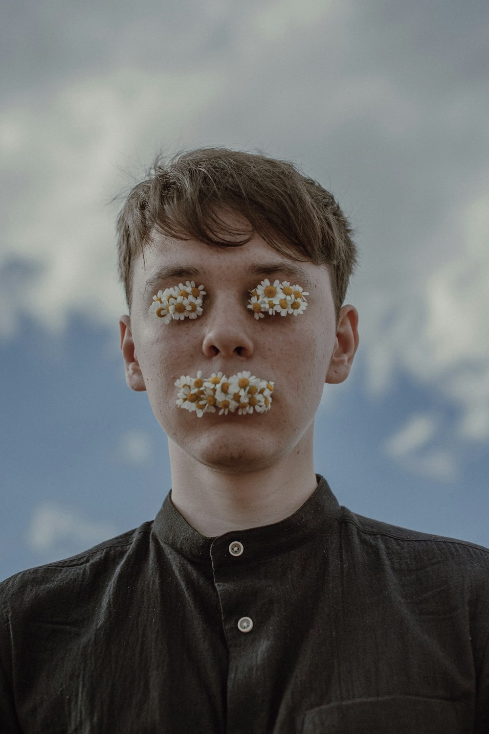 a young man with sprinkles on his face