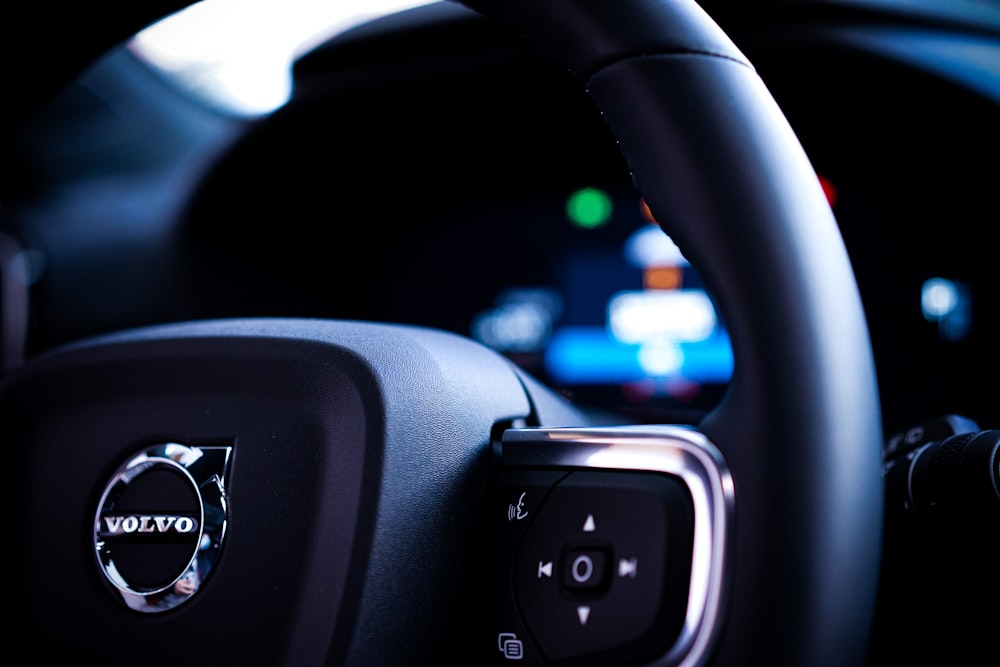 a close up of a steering wheel of a car